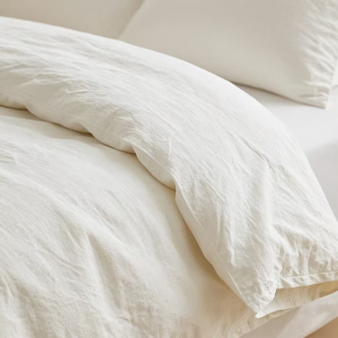 Crisp white linen duvet cover, close detail
